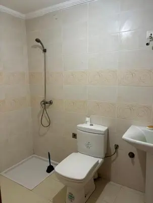 a bathroom with a shower and a toilet and a sink at Appartement sidi rehal l'ocean in Sidi Rahal