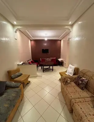 a large living room with couches and a tv at Appartement sidi rehal l'ocean in Sidi Rahal