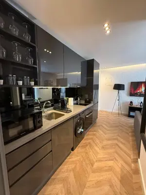 a kitchen with a sink and a counter top at Central Luxury Apartment with Fast Fiber WiFi, Terrace & Free Parking in Casablanca Close To KFC MCDO & School Group La Résidence Boulevard 2 Mars in Casablanca