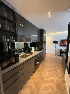 a kitchen with a sink and a dishwasher at Central Luxury Apartment with Fast Fiber WiFi, Terrace & Free Parking in Casablanca Close To KFC MCDO & School Group La Résidence Boulevard 2 Mars in Casablanca