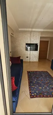a living room with a couch and a flat screen tv at El Mansouria Mohammedia Casablanca in Pont Blondin