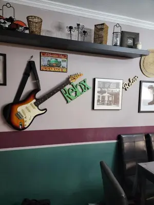 a guitar on the wall of a restaurant at Spacious and convenient in Casablanca
