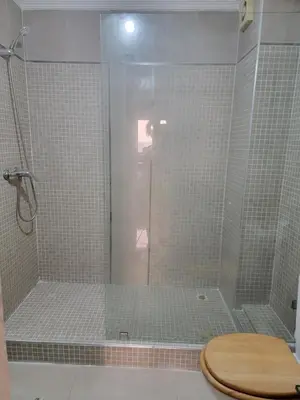 a bathroom with a shower with a toilet in it at Spacious and convenient in Casablanca