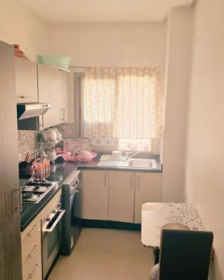 a kitchen with a sink and a stove top oven at Perfect Family Apartment in Tamaris