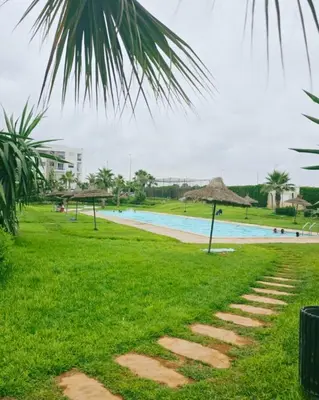 a walkway by the pool at the resort at Perfect Family Apartment in Tamaris