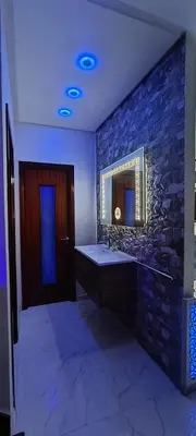 a bathroom with a sink and a stone wall at Rabat sidi yahya zaër in Sidi Yahia az Zaʼer