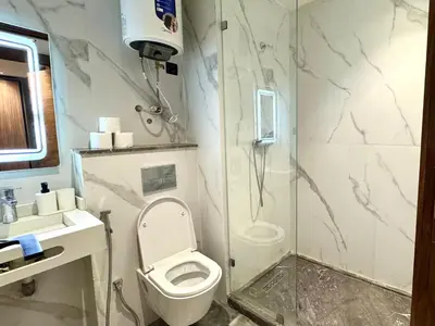 a bathroom with a white toilet and a shower at Studio casablanca connect in Casablanca