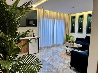 a kitchen and living room with a table and a couch at Studio casablanca connect in Casablanca