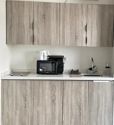 a kitchen counter with a microwave and a sink at Ocean Dream in Casablanca