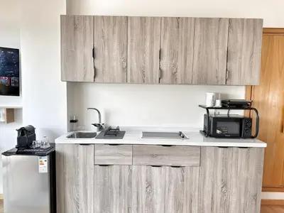 a kitchen with a sink and a microwave at Ocean Dream in Casablanca