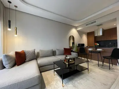 a living room with a couch and a table at A 1 pas de Zara Magnifique Studio Premium in Casablanca