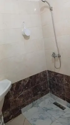 a bathroom with a shower with a toilet and a sink at Kettani bouznika in Bouznika