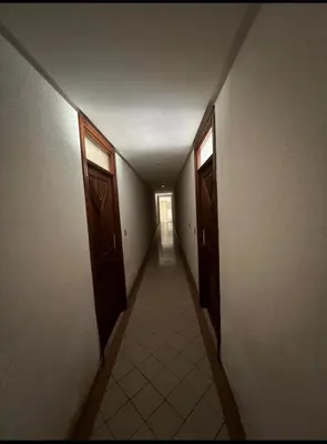 an empty hallway with two open doors and a hallwayngthngthngthngthngthngth at Un charmant Studio Meublé a Casablanca Maarif in Casablanca