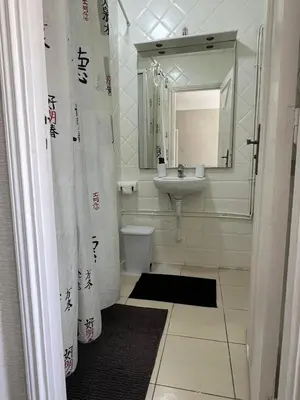 a bathroom with a sink and a toilet and a mirror at Un charmant Studio Meublé a Casablanca Maarif in Casablanca