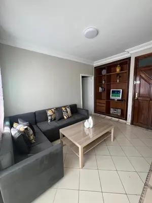 a living room with a couch and a coffee table at Un charmant Studio Meublé a Casablanca Maarif in Casablanca