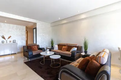 a living room with two couches and a table at NEW - 2CH Val d'Anfa Triangle d'Or - Fibre Optique in Casablanca