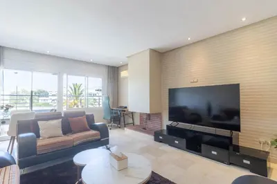 a living room with a large flat screen tv at NEW - 2CH Val d'Anfa Triangle d'Or - Fibre Optique in Casablanca
