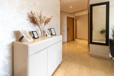 a hallway with a white dresser and a mirror at NEW - 2CH Val d'Anfa Triangle d'Or - Fibre Optique in Casablanca