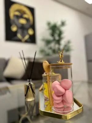 a glass jar filled with pink marshmallows on a table at Business Travel - Luxury 1 BD Flat - Casablanca Finance City in Casablanca