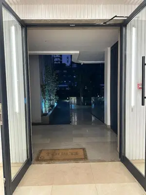 an open door to a hallway in a building at Business Travel - Luxury 1 BD Flat - Casablanca Finance City in Casablanca