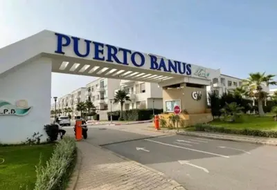 a pucoroco bank building with a sign on it at Puerto banus in Mansouria