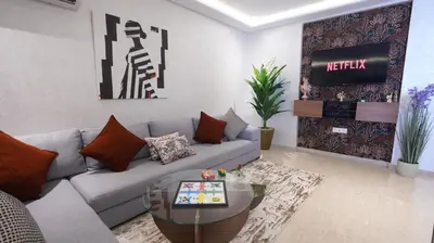 a living room with a couch and a table at Central Quiet Spot in Casablanca