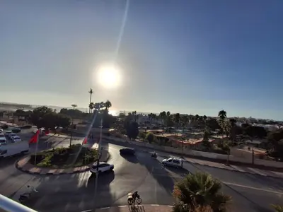 a view of a street with cars in a parking lot at البحر والشمس والطبيعه in Pont Blondin