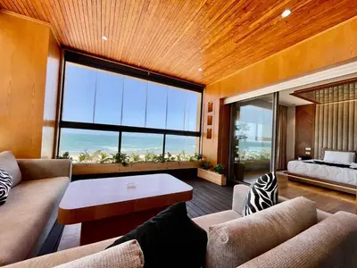 a living room with a couch and a large window at ghaouat luxury appart in Casablanca