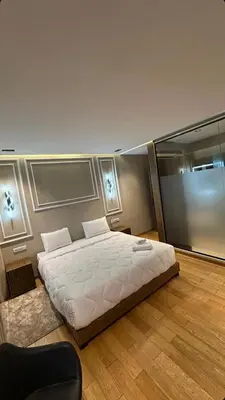 a bedroom with a large white bed in a room at ghaouat luxury appart in Casablanca