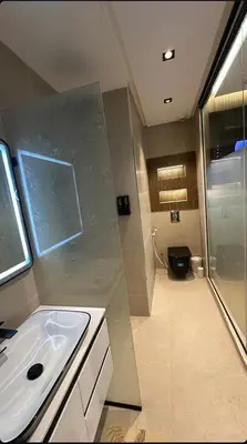 a bathroom with a sink and a shower and a toilet at ghaouat luxury appart in Casablanca