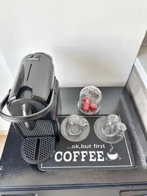 a coffeemaker with two cups of coffee on a table at 3-marina Serena ocean-studio chic vue mer in Casablanca