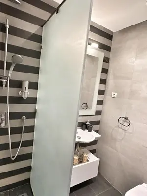 a bathroom with a shower and a sink at 3-marina Serena ocean-studio chic vue mer in Casablanca