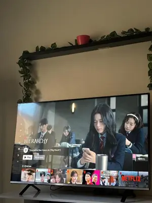a flat screen tv sitting on top of a table at Apprt 2min de la Gare,Wi-Fi Fibre, Netflix ,PS4 in Settat