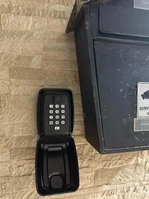 a black cell phone sitting in a box at Apartment with pool view in Mansouria