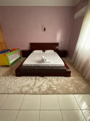 a bed in a bedroom with a mattressvisor at Villa Royale Prestige Safaa in Dar Bouazza