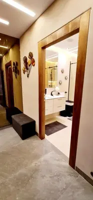 a bathroom with a large mirror and a sink at The Bleu waves in Casablanca