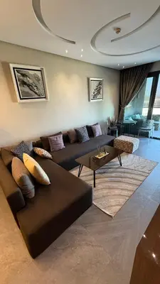 a living room with a couch and a table at The Bleu waves in Casablanca