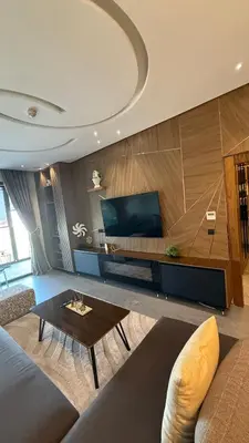 a living room with a couch and a table at The Bleu waves in Casablanca