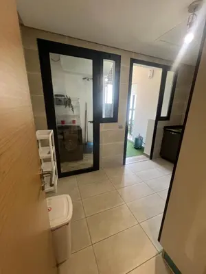 a bathroom with a toilet and a mirror at Appartement Élégance Cosy in Rabat