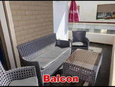 a patio with two chairs and a table and a table and chairs at Mohmmadia puerto banus in Mohammedia