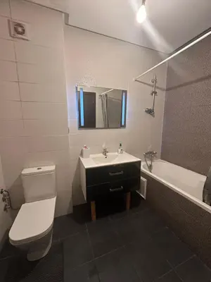 a bathroom with a sink and a toilet and a tub at La siesta beach resort Mohammedia vue mer panoramique in Mohammedia
