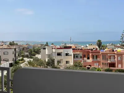 a view of a city from a balcony at La siesta beach resort Mohammedia vue mer panoramique in Mohammedia