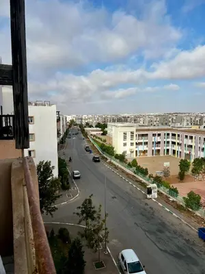 a view of a city street with cars on the road at An Elegant apartment, Quiet Stay with Moroccan Touch in Dar Bouazza