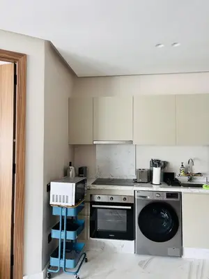 a kitchen with a washing machine and a dishwasher at Premium Apt Casa City Center in Casablanca
