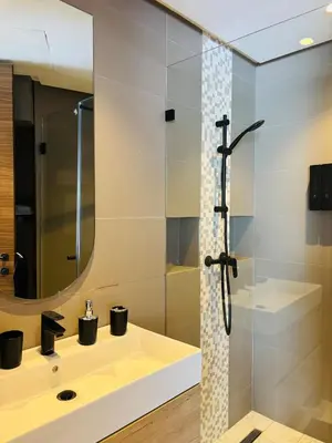 a bathroom with a sink and a shower at Premium Apt Casa City Center in Casablanca