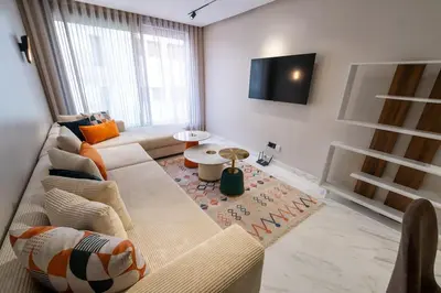a living room with a couch and a table at Exclusive Apt Casa City Center in Casablanca
