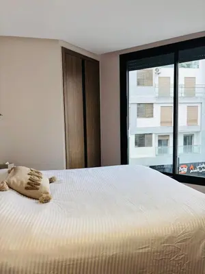 a bedroom with a bed with a pillow on it at Stylish Apt Casa City Center in Casablanca