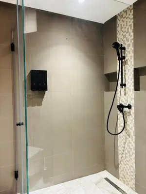 a shower with a glass door in a bathroom at Stylish Apt Casa City Center in Casablanca