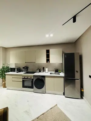 a kitchen with a refrigerator and a dishwasher at Stylish Apt Casa City Center in Casablanca