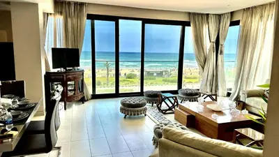 a living room with a view of the ocean at 2 Bedroom Apartment in Casablanca